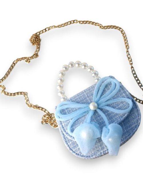 Little girls blue tweed pearl handle purse and gold chain with a large blue thin string bow on the front with a pearl in the middle of the bow.