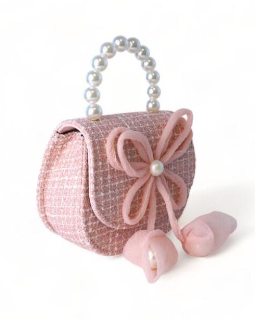 Side view of a little girls pink tweed pearl handle purse with a large pink thin string bow on the front with a pearl in the middle of the bow.

