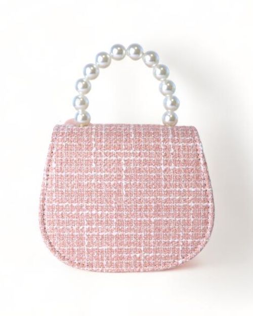 Back side of a little girls pink tweed pearl handle purse 