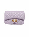 A stylish purple purses with gold accents, including a quilted texture, golden clasp, pearl charm, and detachable chain.