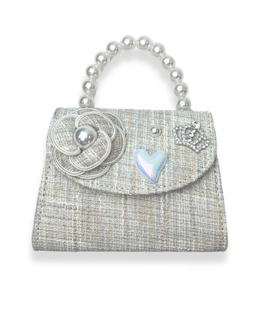 Little girls beige tweed pearl handle purse. On the flap there is a tweed flower with a pearl in the middle of it, pearl heart charm, large pearl charm, and a rhinestone crown charm