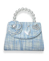 Little girls blue tweed pearl handle purse. On the flap there is a tweed flower with a pearl in the middle of it, pearl heart charm, large pearl charm, and a rhinestone crown charm
