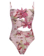 Pink floral print bodysuit featuring 3D flower appliqués, adjustable spaghetti straps, and stylish front and waist cutout details on a white background.