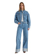 A denim jacket paired with wide-leg pants, showcasing a casual and stylish outfit combination.