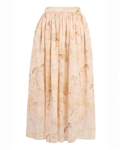 A long skirt adorned with a whimsical horse print on the fabric.