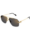 Gold sunglasses with a metal frame and grey lenses, stylishly designed for a modern look.