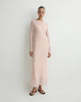 Blush pink sheer long-sleeve maxi dress with a fitted silhouette and flowing hem