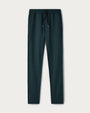 Dark teal jogger pants with a drawstring waistband and tapered leg design, displayed on a light neutral background.