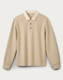 Men's beige long-sleeve polo shirt with classic collar, three-button placket, and ribbed cuffs displayed on a light gray background.