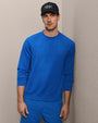 Royal blue crewneck sweatshirt and matching jogger pants with black baseball cap, men's casual athleisure outfit
