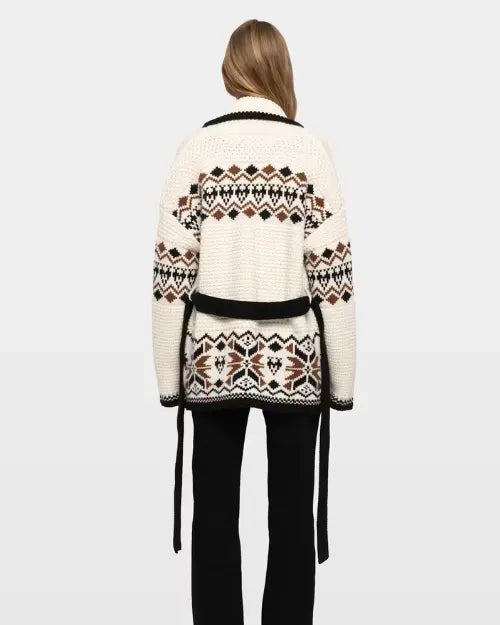 Ivory Fair Isle knit cardigan with black tie belt styled with black pants
