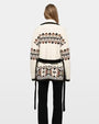 Ivory Fair Isle knit cardigan with black tie belt styled with black pants