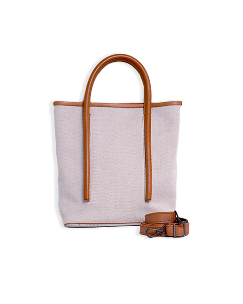 Light pink and brown tote with a handle and detachable shoulder strap.