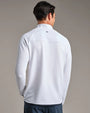 Back view of a white textured performance quarter-zip pullover with long sleeves, worn with navy pants against a neutral studio background.