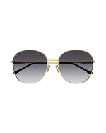 Front view of round-framed sunglasses with a thin gold metal frame with grey lenses. The sunglasses have black earpieces.