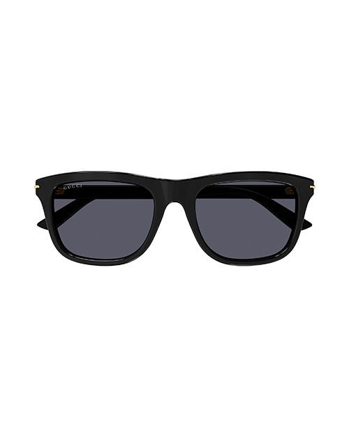 A front view of classic black wayfarer sunglasses with thick frames, featuring gold lettering of the brand name on the temples. The lenses are black.