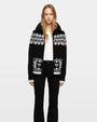 Black and white Fair Isle knit cardigan with zip front and geometric pattern