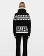 Back view of black and white Fair Isle knit cardigan with geometric pattern