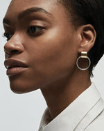 Close up shot of model's side face wearing Faye earring.