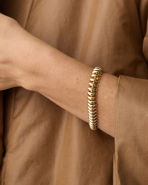 Model's arm wearing Sofia bracelet.