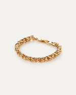 Gold thick twisty braided chain bracelet with the clasp closed