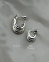 Image of the regular size double stacked hoop earring and the mini size double stacked earring to compare size