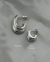 Image of the regular size double stacked hoop earring and the mini size double stacked earring to compare size