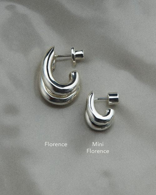 Image of the regular size double stacked hoop earring and the mini size double stacked earring to compare size