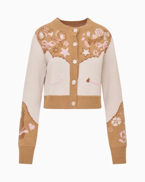 Product image of a cropped tan and cream button-front knit cardigan with star, floral, and horseshoe motifs, ribbed trim, and long sleeves.
