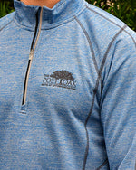 Close up of Post Oak logo embroidered in brown on left chest.