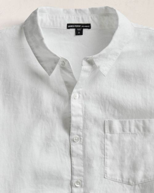 A 100% linen white long sleeve shirt with a chest pocket.
