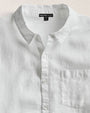 A 100% linen white long sleeve shirt with a chest pocket.