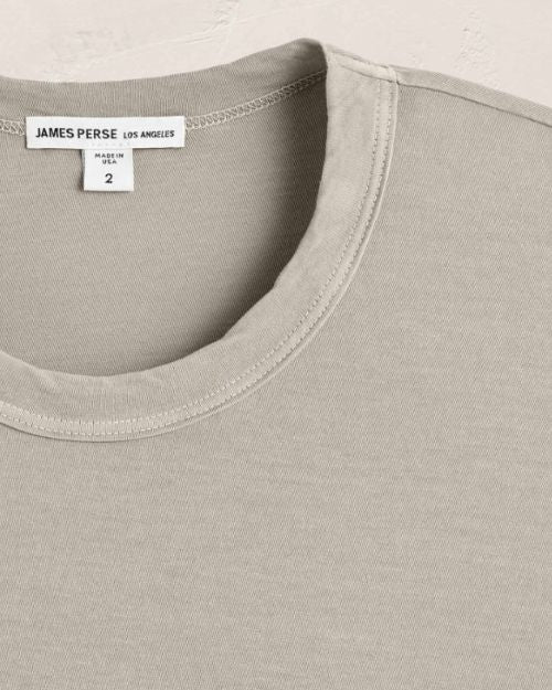 Up-close image of a short sleeve tee featuring a crew neck, perfect for layering or casual styling.