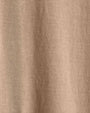 Close-up of cotton fabric, showcasing the texture of a coffee-colored crew neck short sleeve shirt.