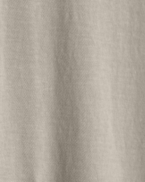 Detailed view of a plain crew neck shirt with short sleeves, emphasizing its minimalist style.