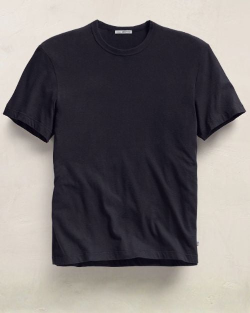 A short sleeve crew neck t-shirt displayed against a white wall.