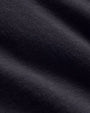 Close-up of a deep colored short sleeve crew neck shirt.
