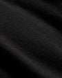 Detailed view of a black long sleeve crew neck cotton shir.