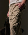 A man in a white shirt paired with cargo pants, highlighting the comfortable Parachute Poplin Cargo material.