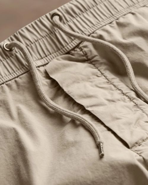 Parachute Poplin Cargo pants with a drawstring waist, designed for comfort and casual wear.