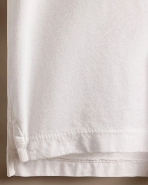 Close-up of a 100% white cotton jersey rugby shirt, showcasing its soft texture and classic design.