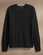 Ultra-fine black cashmere sweater displayed on a neutral background, showcasing its soft texture and elegant design.