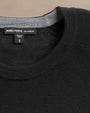  Ultra-fine black cashmere sweater displayed on a neutral background.