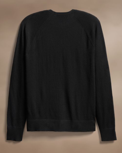 The back view of a sleek black cashmere sweater made from ultra-fine material, highlighting its luxurious feel and minimalist style.