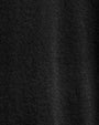 A close-up of an ultra-fine black cashmere sweater, showcasing its soft texture and elegant design.
