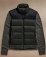 Two tone down front zip up sweater in dark green and black, featuring a zip-up design and a stylish, modern look.
