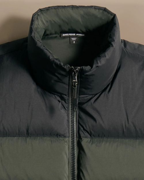 Black and olive green two-tone zip up sweater with a zip closure, designed for warmth and style.