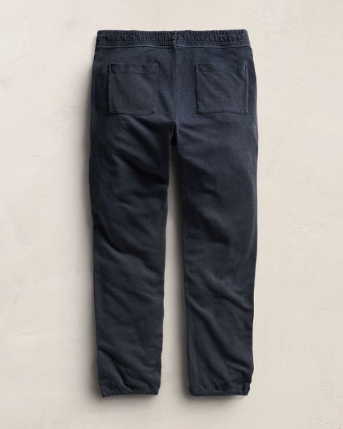 Dark blue vintage French Terry sweatpants laid flat, showcasing their soft fabric and relaxed fit.