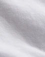 Close-up of a white vintage French Terry zip-up hoodie on a white background, showcasing its lightweight Supima cotton fabric.
