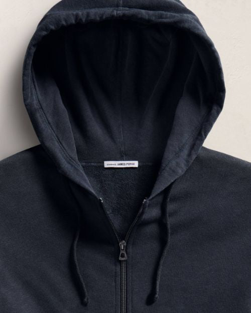 Vintage dark blue zip-up hoodie featuring a front zipper and a classic design.